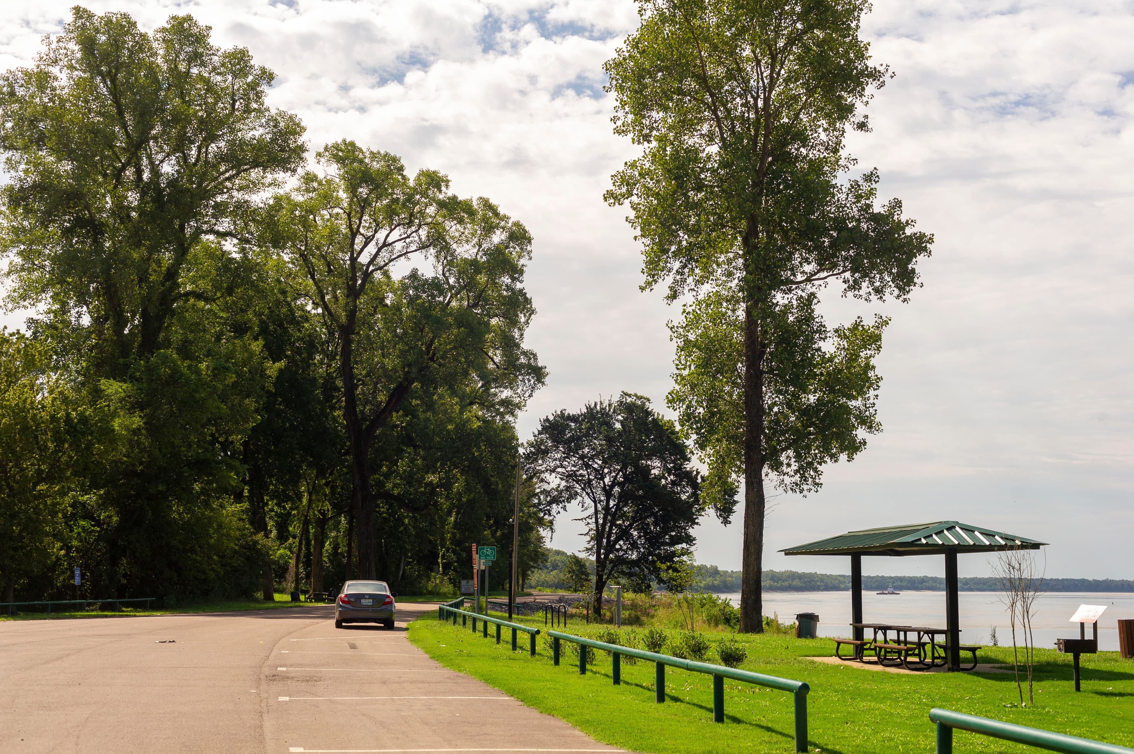 Paved trail and picnic pavilion overlooking the Mississippi River at Hernando DeSoto River Park in Walls